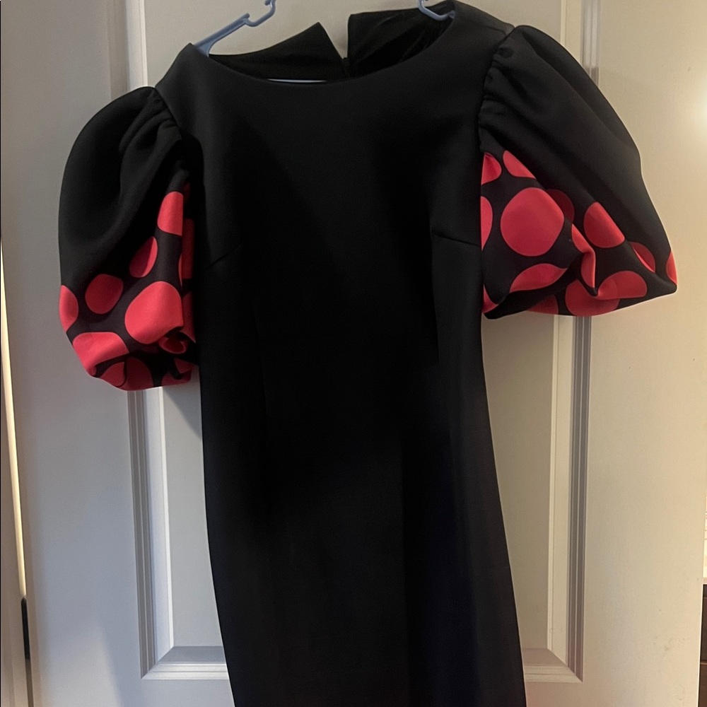 Elegant Black Dress with Red Polka Dot Sleeves